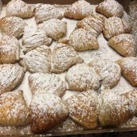 Sfogliatelle · Flaky layered shell with a sweet cream filling made with ricotta cheese.
