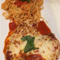Chicken Parmigiana · Chicken Parmigiana dinner is served with bread, choice of pasta, salad or vegetable of the day