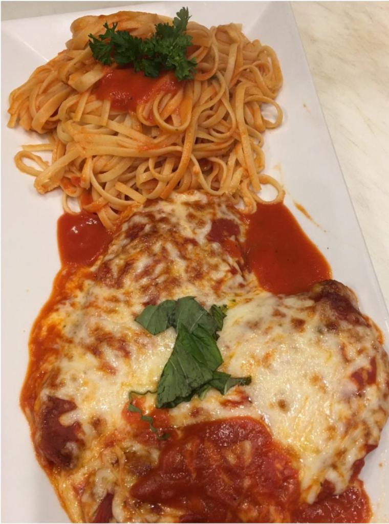 Chicken Parmigiana · Chicken Parmigiana dinner is served with bread, choice of pasta, salad or vegetable of the day