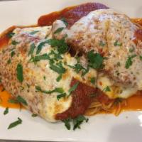 Veal Parmigiana · Veal Parmigiana dinner is served with bread, choice of pasta, salad or vegetable of the day