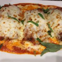 Eggplant Rollatini · Thinly sliced eggplant rolled with fresh ricotta and prosciutto topped with tomato sauce and...