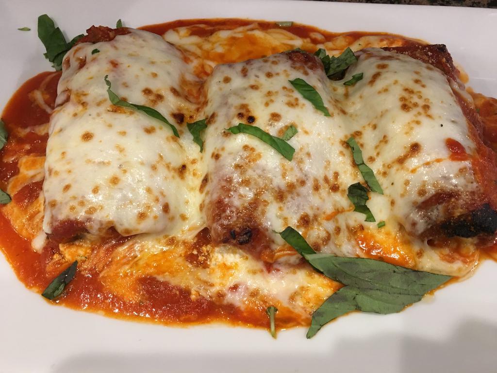 Eggplant Rollatini · Thinly sliced eggplant rolled with fresh ricotta and prosciutto topped with tomato sauce and Romano cheese. Entrees served with bread, choice of pasta, salad or vegetable of the day.