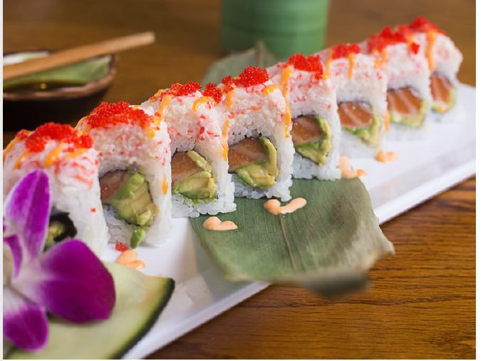 Arizona Roll · Spicy salmon, avocado, cucumber. Top: crab salad with spicy sauce tobiko.
