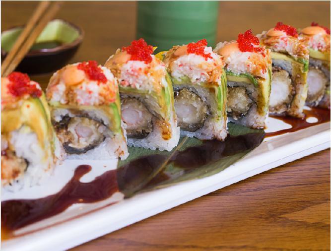 Crazy Roll · Salmon skin, eel, shrimp tempura. Top: crab salad, avocado, spicy and sweet sauce and tobiko.