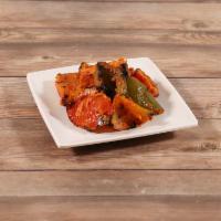 Paneer Tikka · Homemade cheese cubes marinated with yogurt and spices, grilled in a clay oven with chunks o...