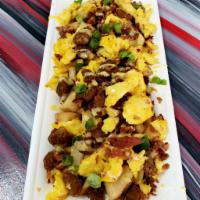 Loaded Home Fries · Topped with eggs, bacon, sausage, green onions, and hollandaise sauce. 