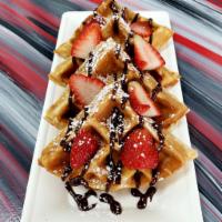 4 the Love of Nutella  Sweet Waffles · Nutella topped with Nutella sauce, powdered sugar and strawberries. 