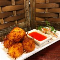 Coconut Tofu · Deep-fried battered tofu with grated coconut and bread crumbs with plum sauce and peanut.
