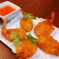 Coconut Prawns · Golden prawns deep-fried in coconut tempura batter, served with sweet and sour sauce.