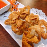 Crab Delight · Deep-fried won-ton wrappers filled with real crab meat and cream cheese served with sweet an...
