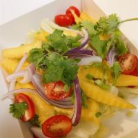 Mango Salad · Sweet and sour mango with red onion, green onion, cilantro, tomatoes in lime juice dressing.