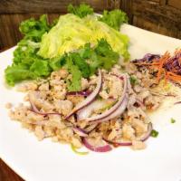 Chicken Larb · Crisp lettuce served with ground chicken tossed with roasted ground rice, lime juice, red on...