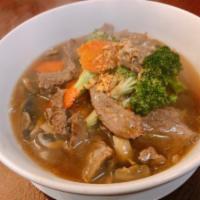 Rad Nah · Stir fried wide rice noodles, broccoli, carrots, mushroom topped with homemade gravy broth.
