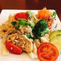 Simply Fried Rice · Stir fried jasmine rice with egg, onion, tomatoes and broccoli.