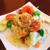 Garlic Fried Rice · Stir fried jasmine rice with egg, cabbage, carrot, broccoli top with crispy garlic.
