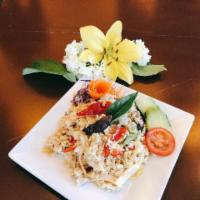 Green Curry Fried Rice · Stir fried jasmine rice with egg, bell pepper, bamboo shoots and Thai basil in green curry p...