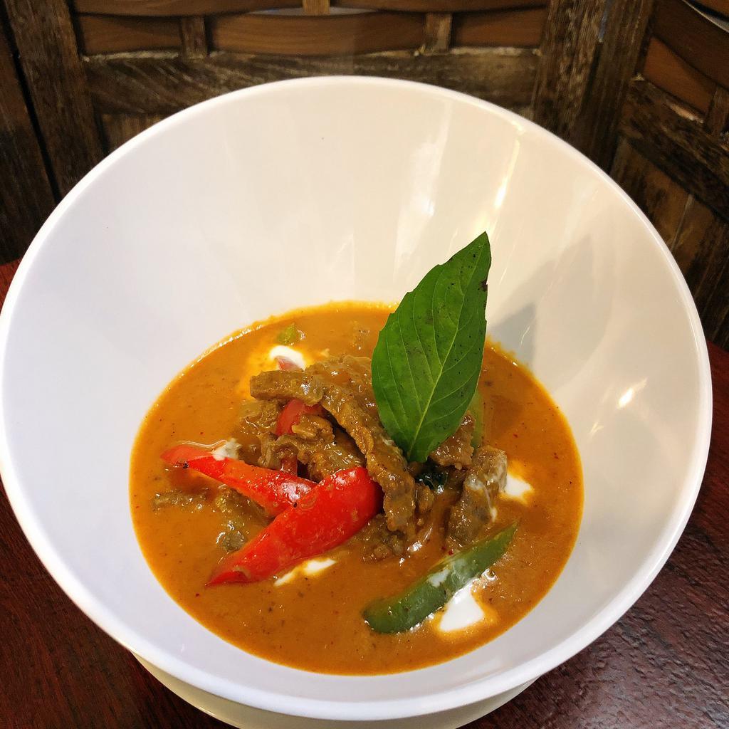 Panang Curry · Panang curry paste with coconut milk, bell peppers and Thai basil.