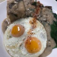 Sam's Breakfast · Sauteed spinach,mushrooms and onions. Fresh baked biscuit, topped with house gravy and two b...