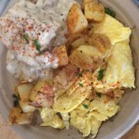 Pow's Breakfast · Pan fried potatoes, peppers and onions, two scrambled eggs and a house made biscuit topped w...