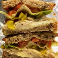 Spicy Turkey Sandwich (grilled) · Diestel Farms turkey, swiss cheese, tomato, pepperoncinis & romaine lettuce with stone groun...