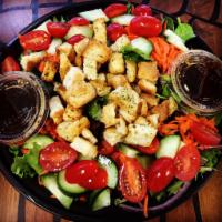 The Local Greens Salad · Spring mix, cucumbers, carrots, tomatoes, red onions & house made croutons with house made s...