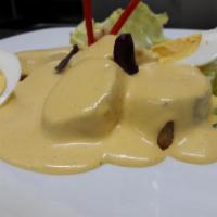 Papa a la Huancaina  · Potatoes served with a typical Peruvian sauce, olives and boiled eggs. 