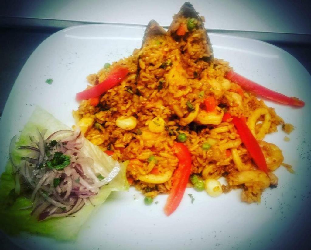 Seafood Rice · Peruvian style paella with selected seafood or just shrimp with a hint of truffle oil. 