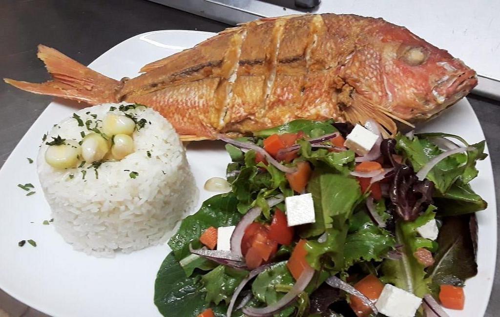 Pargo Entero  · Whole red snapper, served with white rice and house salad. 