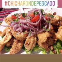 Chicharron de Pescado  · Deep fried fish (chunks) with criolla sauce and golden yuca. 