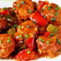 Chicken Manchurian · Cubes of chicken fried and tossed in a tangy Chinese sauce with dash of Indian spices.