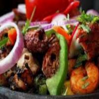 Tandoori Mix Grill · From Indian clay oven. Platter of tandoori (chicken, shrimp, and fish), chicken tikka and la...