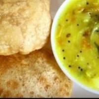 Poori Masala · Whole wheat fully bread served with potato masala.