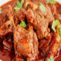 Lamb Vindaloo · For the one with true passion for spicy food lamb and potatoes cooked in fiery red chili and...