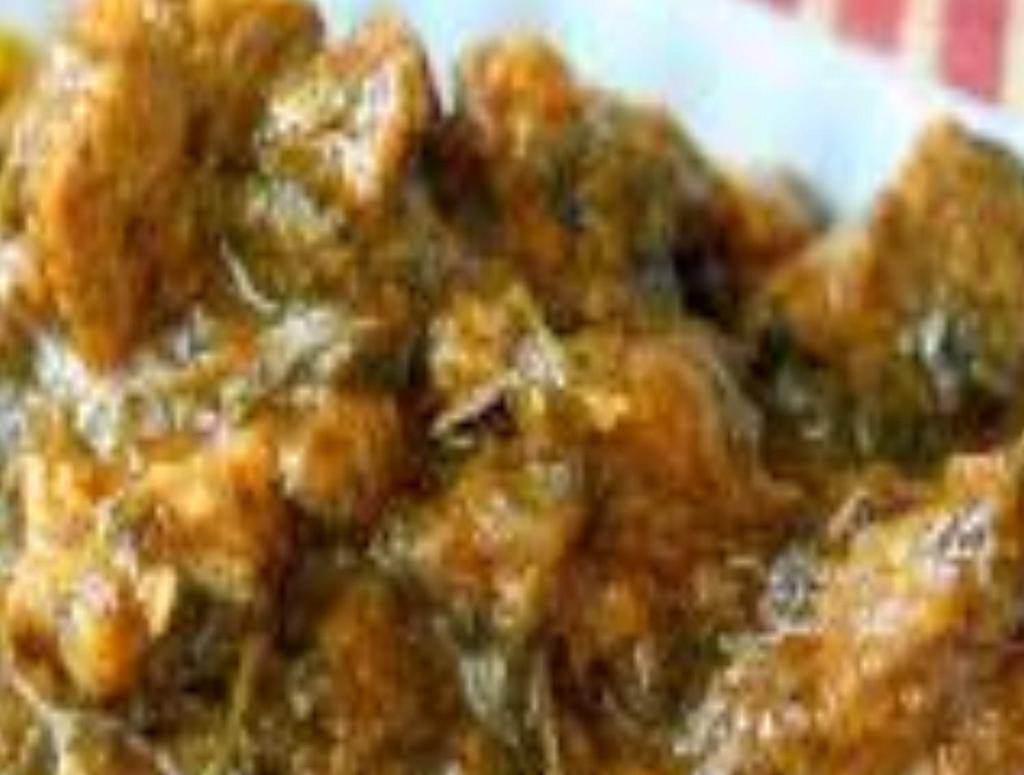 Lamb Gongura · Lamb with gongura (red sorrel leaves) cooked with special spicy curry sauce.
