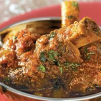 Goat Curry · Goat (with bone) marinated and cooked in curry sauce of fresh herbs and spices.