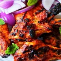 Tandoori Chicken (with bone) · Chicken with bones marinated in yogurt, fresh spices and lemon juice then barbecued in tando...