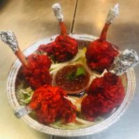 Chicken Lollipop · Loosened and marinated Chicken winglet pulled down  to make a lollipop appearance, deep frie...