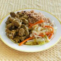 Curry Goat · Spiced sauce.