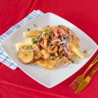 15. Jalea de Pescado  · Lightly breaded fried fish served on a bed of fresh lettuce, garnished with shrimp, served w...