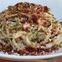 Carbonara · Spaghetti, eggs, Parmesan, crispy bacon, parsley and olive oil.
