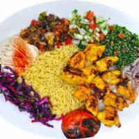 Chicken Tikka  · 12 Grilled marinated cubed chicken paces served with rice. It is served with Iraqi salad and...