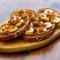 Nutella Toast · Nutella, sliced bananas and granola.