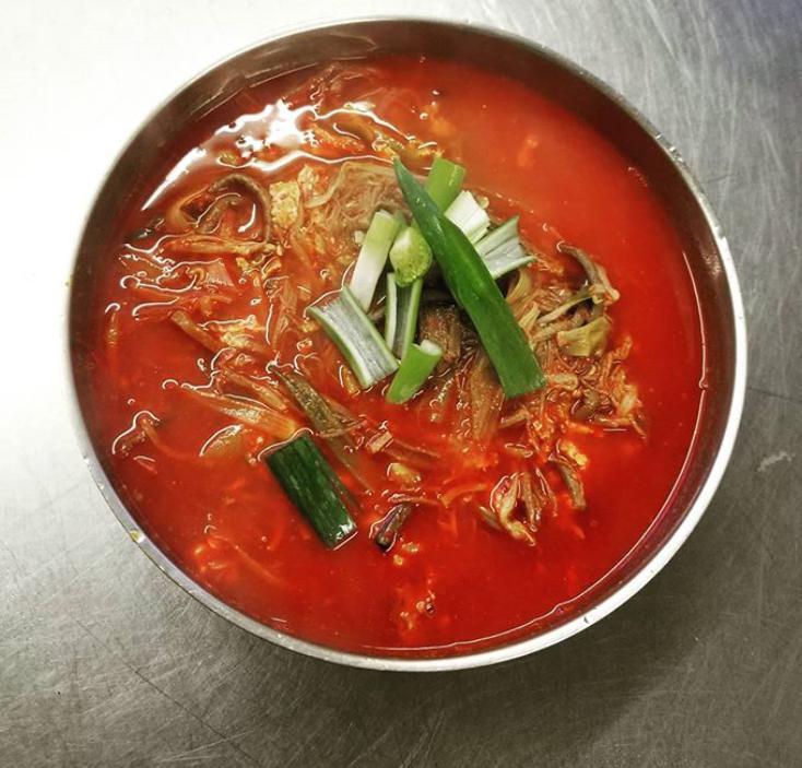 Spicy Beef Soup (Yukgaejang) · Spicy soup made with shred beef flank steak, green onion, sprouts, bracken and glass noodle. Served with 1 purple rice and 5 side dishes.