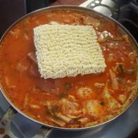 Spicy Ham and Sausage Casserole (Army Stew) (serves 3 people) · Spicy soup with ham, sausage, beef, spam, cabbage, green onion, rice cake with ramen noodle....