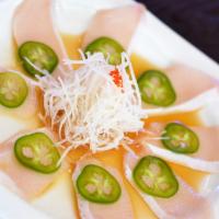 Yellowtail Jalapeno · Thin slice of Yellowtail sashimi, top with jalapeno and ponzu sauce.