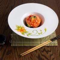 42. Salmon Tartar · Marinated with spicy sauce, soy sauce and sesame oil topped with caviar.