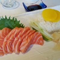 Salmon Don · 12 pieces sliced salmon over seasoned rice. Served with soup and salad.