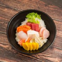 Chirashi  · 12 Pieces of raw fish over seasoned rice. Served with soup and salad.