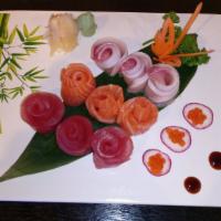 Triple Color Sashimi · 6 pcs of tuna, 6 pcs of yellowtail, 6 pcs of salmon. rice on the side
