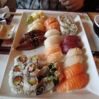 Sushi for 2 · 18 pieces of assorted sushi with dragon roll and spicy tuna roll. Served with miso soup or s...